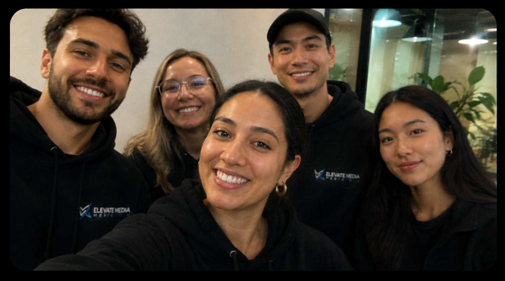 The Elevate Media team together in the office